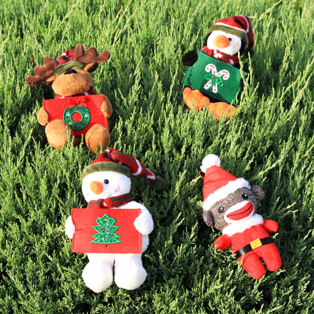 9" Lie down Grass Gift Card Holder Reindeer, Snowman, Penguin Plush Toy, A Cute Penguin Wearing Festive Accessories by Plushland.