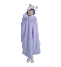 Person wearing weighted panda hooded blanket with bear ears on a white background