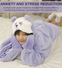 Person wearing a weighted panda purple blanket hoodie with a panda design, lying on a bed.