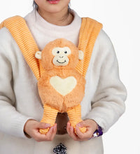 Child holding weighted small monkey hugger weighted monkey stuffed animal