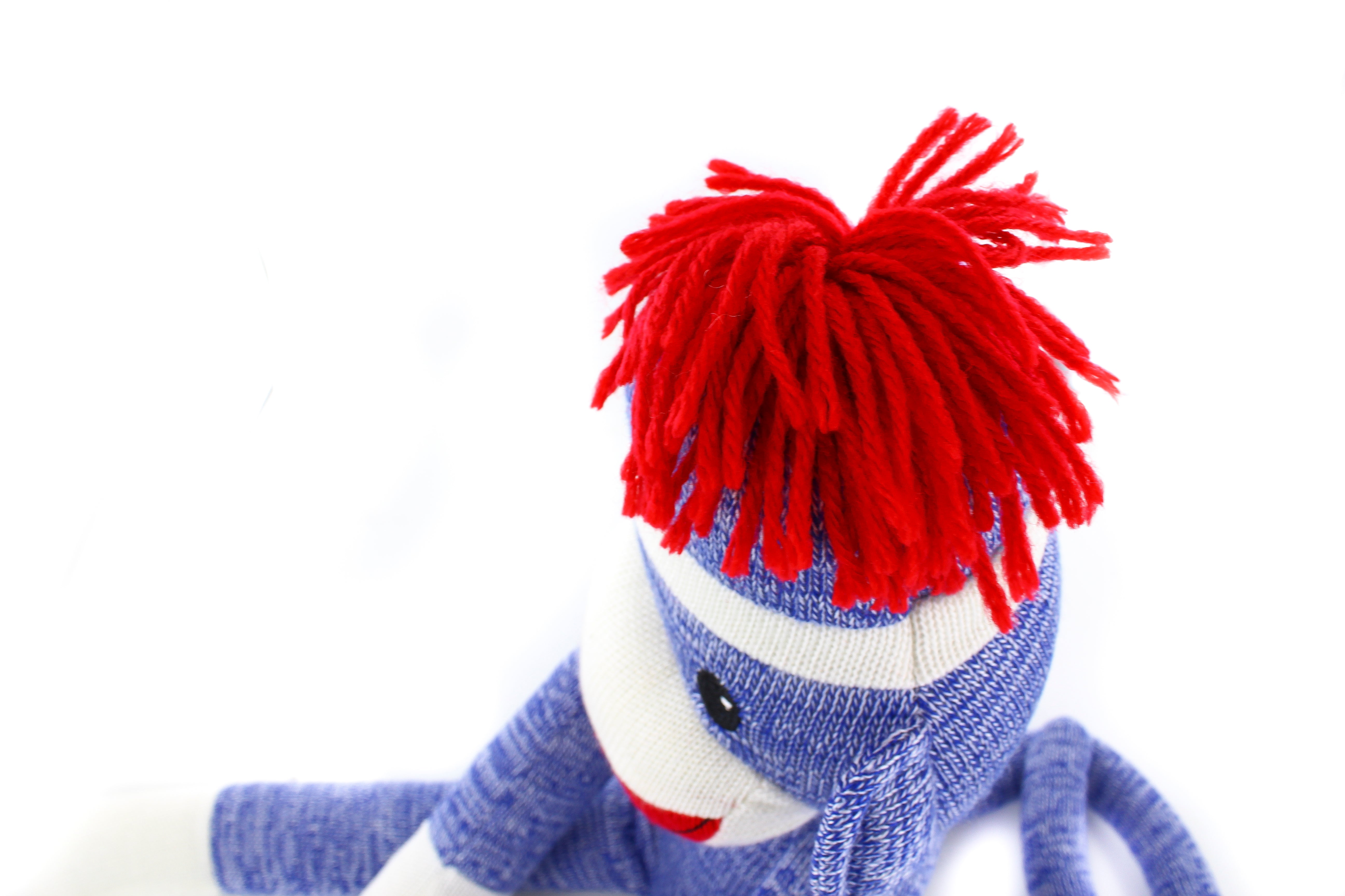 Top view of 20-inch blue Colors of Love Sockiez sitting, soft plush toy by Plushland